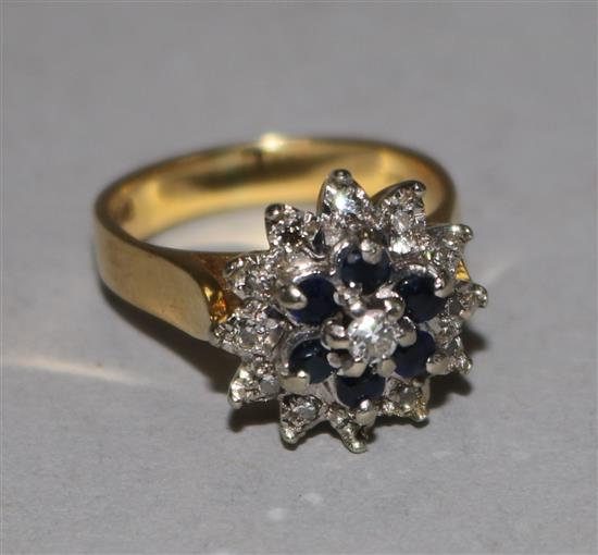 An 18ct gold, sapphire and diamond cluster ring, size I.